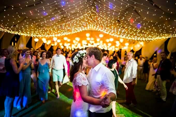 Beautiful wedding marquee filled with silk lanterns and fairy lights